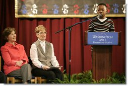 Mrs. Laura Bush and Dr. Tish Howard, Principal, Washington Mill Elementary School, listen as Damien Floyd, Student, reads an essay he wrote on George Washington, during a Mount Vernon's "George Washington's Return to School" ceremony at Washington Mill Elementary School Tuesday, January 15, 2008, in Alexandria, Virginia. The “Portrait of Leadership” initiative was planned to coincide with the 275th birthday year of George Washington, celebrated in February of 2007, to help put a portrait of George Washington in class rooms in all fifty states.  White House photo by Shealah Craighead