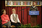 Mrs. Laura Bush and Dr. Tish Howard, Principal, Washington Mill Elementary School, listen as Damien Floyd, Student, reads an essay he wrote on George Washington, during a Mount Vernon's "George Washington's Return to School" ceremony at Washington Mill Elementary School Tuesday, January 15, 2008, in Alexandria, Virginia. The “Portrait of Leadership” initiative was planned to coincide with the 275th birthday year of George Washington, celebrated in February of 2007, to help put a portrait of George Washington in class rooms in all fifty states. White House photo by Shealah Craighead