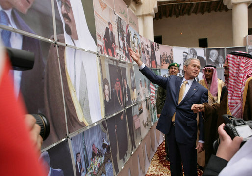 President George W. Bush points to a photo of his father, President George H.W. Bush, as he visits Al Murabba Palace and National History Museum Tuesday, Jan. 15, 2008, in Riyadh. White House photo by Chris Greenberg