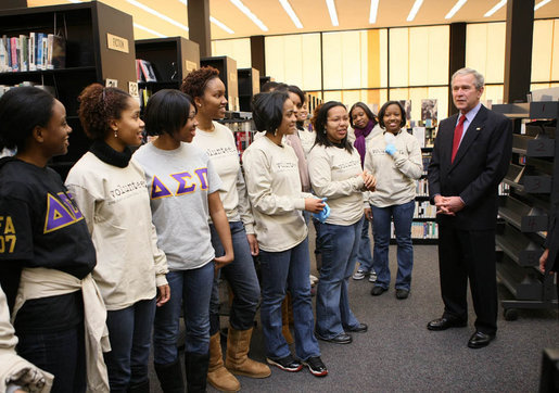 President George W. Bush speaks with volunteers, thanking them for their service, during a visit to the Martin Luther King, Jr., Memorial Library Monday, Jan 21, 2008, in Washington, D.C., in commemoration of Martin Luther King, Jr., Day. White House photo by Eric Draper