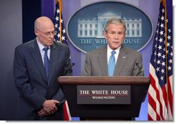 With Secretary of Treasury Hank Paulson looking on, President George W. Bush delivers a statement on the Bipartisan Economic Growth Agreement Thursday, Jan. 24, 2008, in the James S. Brady Press Briefing Room at the White House. Said the President, "I thank the Speaker and I thank Leader Boehner for their hard work. and for showing the American people that we can come together to help our nation deal with difficult economic challenges."  White House photo by Chris Greenberg