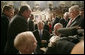 President George W. Bush is surrounded by members of Congress as he prepares to leave the House chamber Monday evening, Jan. 28, 2008 at the U.S. Capitol, following the President's State of the Union Address. White House photo by Eric Draper