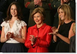 Mrs. Laura Bush, joined by her daughters, Barbara, left, and Jenna applaud from the First Lady's box at the U.S. Capitol, as President George W. Bush delivers his State of the Union Address Monday, Jan. 28, 2008. White House photo by Joyce N. Boghosian