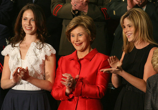 Mrs. Laura Bush, joined by her daughters, Barbara, left, and Jenna applaud from the First Lady's box at the U.S. Capitol, as President George W. Bush delivers his State of the Union Address Monday, Jan. 28, 2008. White House photo by Joyce N. Boghosian