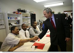 President George W. Bush shakes hands with a participant in the Jericho Program while visiting a classroom Tuesday, Jan. 29, 2008, in Baltimore. Serving men 18 years and older who have been released from prison within the last 6 months and who have never been convicted of a violent offense, the program helps them rebuild their lives while fostering a new sense of self-worth and a commitment to productive, healthy lifestyles. White House photo by Joyce N. Boghosian