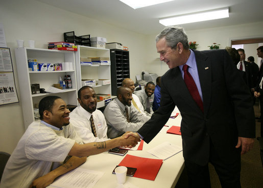 President George W. Bush shakes hands with a participant in the Jericho Program while visiting a classroom Tuesday, Jan. 29, 2008, in Baltimore. Serving men 18 years and older who have been released from prison within the last 6 months and who have never been convicted of a violent offense, the program helps them rebuild their lives while fostering a new sense of self-worth and a commitment to productive, healthy lifestyles. White House photo by Joyce N. Boghosian