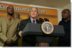 President George W. Bush stands next to graduates Adolphus Mosely, left, and Thomas Boyd, as he delivers remarks after visit the faith-based Jericho Program Tuesday, Jan. 29, 2008, in Baltimore. Said the President, "I've come to look firsthand at the Jericho Program, which is helping former prisoners make a successful transition back to society. There's no more important goal than to help good souls become -- come back to our society as productive citizens. I'm honored to have been with those who have worked hard to deal with their circumstances in such a way that they become productive citizens. I'm standing next to two such men, and I met probably seven others downstairs." White House photo by Joyce N. Boghosian