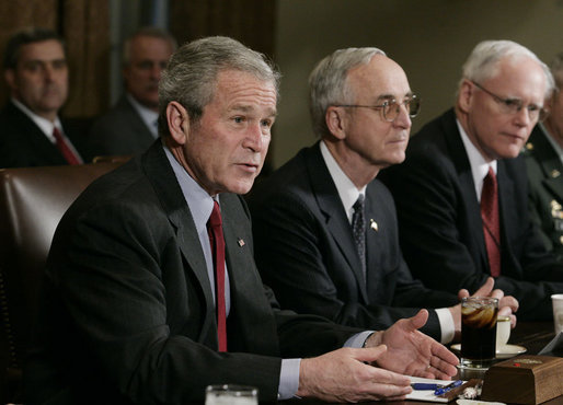 President George W. Bush, joined by Deputy Secretary of Defense Gordon England, center, and Deputy National Security Advisor James Jeffrey, right, talks to reporters Tuesday, Jan. 29, 2008, during a meeting in the Cabinet Room of the White House with the Joint Chiefs and Combatant Commanders. White House photo by Eric Draper