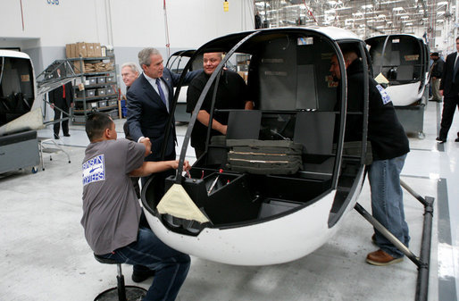 President George W. Bush meets with assembly workers on a tour of the Robinson Helicopter Company Wednesday, Jan. 30, 2008 in Torrance, Calif. President Bush later addressed employees and members of the media speaking in support of the propose economic stimulus package and the importance of free trade agreements for the nation’s economy. White House photo by Eric Draper