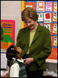Mrs. Laura Bush listens to a kindergarten student during her visit at Holy Redeemer School Wednesday, Jan. 30. 2008. White House photo by Shealah Craighead