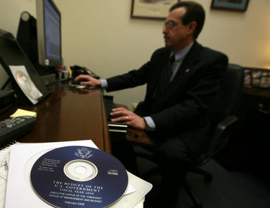 The Executive Clerk of the White House electronically transmits the FY2009 Budget Monday, Feb. 4, 2008, marking the first time in American history that the Executive Branch has electronically transmitted a budget proposal, or any official government document, to the Legislative Branch. The Executive Clerk used an approved credential to digitally sign the electronic transmittal of the FY09 Budget, thus proving the document's authenticity. White House photo by Joyce N. Boghosian