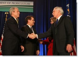 President George W. Bush congratulates Secretary of Agriculture Ed Schafer after he was ceremoniously sworn in Wednesday, Feb. 6, 2008, at the U.S. Department of Agriculture. In the background are Mrs. Nancy Schafer and Deputy Secretary Chuck Conner. White House photo by Chris Greenberg