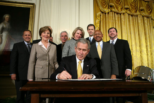 President George W. Bush signs an Executive Order establishing the Interagency Working Group on Youth Programs at the Helping America's Youth Event Thursday Feb. 7, 2008, in the East Room of the White House. The Executive Order is a coalition of Federal agencies that will help support communities and organizations working to help our Nation's youth. White House photo by Chris Greenberg