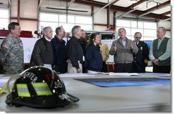 President George W. Bush attends a briefing on regional tornado damage shortly after arriving Friday, Feb. 8, 2008, at the Lafayette Fire Department in Lafayette, Tennessee. The President visited the area in the wake of Tuesday's deadly tornadoes. White House photo by Chris Greenberg