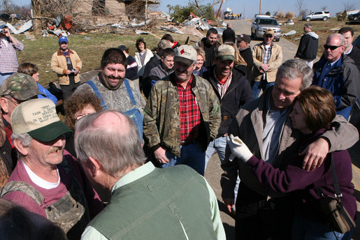 President George W. Bush puts his arm around a woman as he meets residents of Lafayette, Tennessee, Friday, Feb. 8, 2008, during his visit to assess the damage and offer comfort to those impacted by Tuesday's deadly tornadoes. White House photo by Chris Greenberg