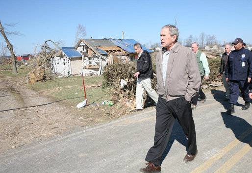 President George W. Bush walks a rubble-strewn stretch of highway in Lafayette, Tennessee Friday, Feb. 8, 2008, during his visit to the region that was hard hit by tornadoes earlier in the week. White House photo by Chris Greenberg