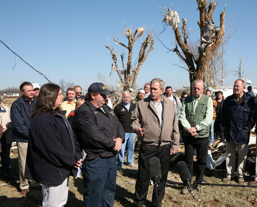 President George W. Bush stands with Phil and June Spears of Lafayette, Tennessee, as he speaks to the media after touring the region that was among the hardest hit by Tuesday's deadly tornadoes. Said the President, "We're sorry you're going through what you're going through. You know, life sometimes is unfair and you don't get to play the hand that you wanted to play. But the question is when you get dealt the hand, how do you play it? I've come away with this impression of the folks in Macon County:.You're down to earth, good, hard-working people; they have a respect for the Almighty; and this community is going to be as strong as ever." White House photo by Chris Greenberg