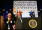 President George W. Bush acknowledges the audience after delivering remarks Friday, Feb. 8, 2008, to the 35th Conservative Political Action Conference in Washington, D.C. With him is Dave Keene, Chairman of the American Conservative Union. White House photo by Joyce N. Boghosian