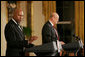 Actor Avery Brooks, (L), and Dr. Allen Guelzo make remarks during a ceremony in the East Room of the White House honoring Abraham Lincoln's 199th Birthday, Sunday, Feb. 10, 2008. White House photo by Chris Greenberg