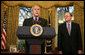 With Michael McConnell, Director of National Intelligence, looking on, President George W. Bush delivers a statement on the Protect America Act Wednesday, Feb. 13, 2008, in the Oval Office of the White House. Said the President, "It is time for Congress to ensure the flow of vital intelligence is not disrupted. It is time for Congress to pass a law that provides a long-term foundation to protect our country. And they must do so immediately." White House photo by Joyce N. Boghosian