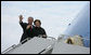 President George W. Bush and Mrs. Laura Bush wave from Air Force One as they board the aircraft Friday, Feb. 15, 2008, at Andrews Air Force Base en route to Benin, the first stop on their five-country, African visit. White House photo by Chris Greenberg