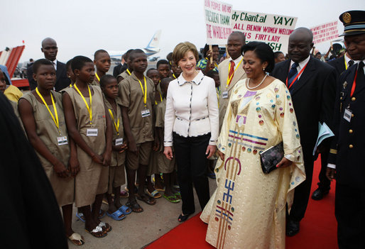 Mrs. Laura Bush and Madame Chantal de Souza Yayi, First Lady of Benin, walk the red carpet upon the arrival Saturday, Feb. 16, 2008, of Mrs. Bush and President George W. Bush to Benin. White House photo by Eric Draper
