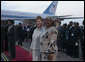 Mrs. Laura Bush and Sala Kikwete, wife of President Jakaya Kikwete of Tanzania, stand on the red carpet Saturday, Feb. 16, 2008, after the arrival of President George W. Bush and Mrs. Bush to Julius Nyerere International Airport in Dar es Salaam. White House photo by Shealah Craighead