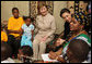 Mrs. Laura Bush joins a discussion with orphans and caretakers at the WAMA Foundation Sunday, Fab. 17, 2008 in Dar es Salaam, Tanzania, during a meeting to launch the National Plan of Action for Orphans and Vulnerable Children. White House photo by Shealah Craighead