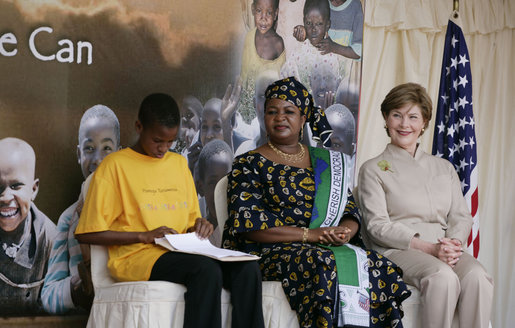 Mrs. Laura Bush and Mrs. Salma Kikwete, First Lady of Tanzania, enjoy Salvation Army Children as they perform on stage Sunday, Feb. 17, 2008, at the WAMA Foundation in Dar es Salaam. The foundation, founded by Mrs. Kikwete, is a non-profit organization focusing on development by improving women’s social and economic status by redefining gender roles and creating more opportunities for the development of women and children. White House photo by Shealah Craighead