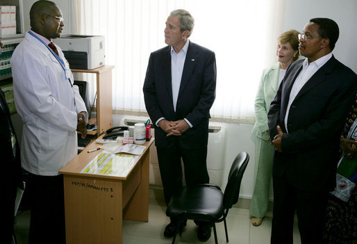 President George W. Bush and Mrs. Laura Bush, joined by Tanzanian President Jakaya Kikwete, visit with a staff doctor Sunday, Feb. 17, 2008, at the Amana District Hospital in Dar es Salaam, Tanzania, where President Bush and Mrs. Bush visited a patients and staff at the hospital's care and treament clinic. White House photo by Chris Greenberg