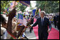 President George W. Bush shakes hands as he greets a large cheering crowd on his arrival Sunday, Feb. 17, 2008, to the State House in Dar es Salaam, Tanzania. White House photo by Eric Draper