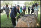 President George W. Bush lays a wreath Sunday, Feb. 17, 2008 in the memorial garden of the U.S. embassy in Dar es Salaam in Tanzania, during a memorial remembrance for those who died in the 1998 U.S. embassy bombing. U.S. Secretary of State Condoleezza Rice stands in background. White House photo by Eric Draper