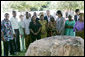 President George W. Bush and Mrs. Laura Bush, joined by U.S. Secretary of State Condoleezza Rice, stand with the family members of victims during a moment of silence Sunday, Feb. 17, 2008 in the memorial garden of the U.S. embassy in Dar es Salaam in Tanzania, in remembrance for those who died in the 1998 U.S. embassy bombing. White House photo by Chris Greenberg