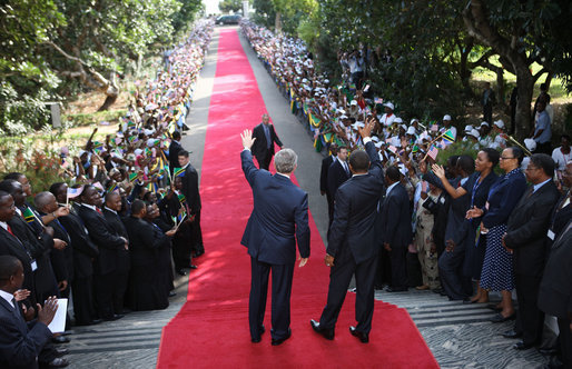  President George W. Bush and President Jakaya Kikwete of Tanzania, wave to the ceremonial arrival cordon as they reach the steps of the State House in Dar es Salaam Sunday, Feb. 17, 2008. White House photo by Eric Draper