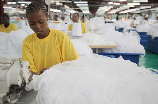 An employee at the A to Z Textile Mills in Arusha, Tanazia, stitches mosquito nets Monday, Feb. 18, 2008, where President George W. Bush and Mrs. Laura Bush toured the mill and visited with employees. White House photo by Shealah Craighead