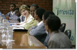 Mrs. Laura Bush joins Rwanda first lady Jeannette Kagame, center, as they listen to students during a forum Tuesday, Feb. 19, 2008 in Kigali, Rwanda, to promote girl's education. White House photo by Shealah Craighead