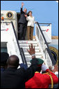 President George W. Bush and Mrs. Laura Bush wave from the steps of Air Force One Feb. 19, 2008, as they depart from Julius Nyerere International Airport in Dar es Salaam, Tanzania. The President and Mrs. Bush are on their way to Rwanda, the third stop of their five-nation tour. White House photo by Chris Greenberg