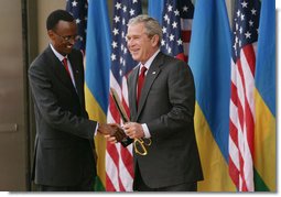 President George W. Bush and President Paul Kagame shake hands Tuesday, Feb. 19, 2008, following the dedication and ribbon cutting ceremony to formally open the new United States Embassy in Kigali, Rwanda. White House photo by Chris Greenberg
