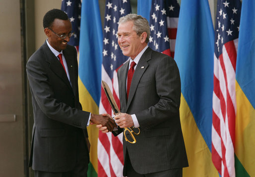 President George W. Bush and President Paul Kagame shake hands Tuesday, Feb. 19, 2008, following the dedication and ribbon cutting ceremony to formally open the new United States Embassy in Kigali, Rwanda. White House photo by Chris Greenberg