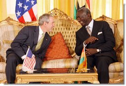 President George W. Bush speaks with Ghana President John Agyekum Kufuor during their meeting at Osu Castle, Wednesday, Feb. 20, 2008 in Accra, Ghana. White House photo by Eric Draper