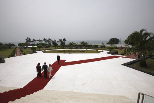 President George W. Bush and Mrs. Laura Bush walk with President of Liberia, Ellen Johnson Sirleaf, Thursday, Feb. 21, 2008, on the lawn of the Executive Mansion overlooking the coast in Monrovia, Liberia. White House photo by Eric Draper