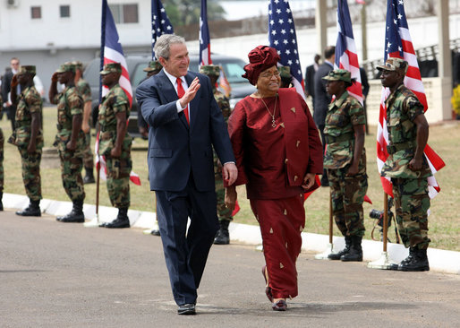 President George W. Bush and President Ellen Johnson Sirleaf of Liberia pass an honor guard Thursday, Feb. 21, 2008, during the President's visit to Monrovia, Liberia. White House photo by Eric Draper