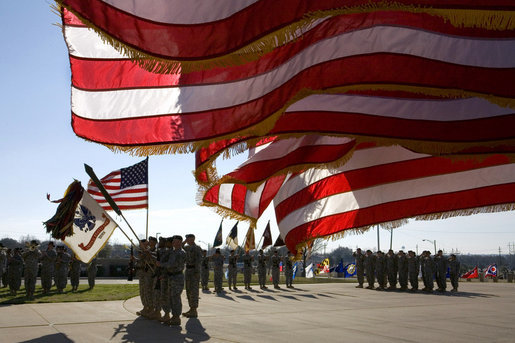 U.S. flags wave in the wind Tuesday, Feb. 26, 2008 during an Uncasing of the Colors Ceremony for the Third Corps at Fort Hood, Texas. White House photo by David Bohrer