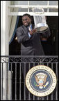 Boston Red Sox's slugger David Ortiz raises the 2007 World Championship Trophy for the crowd during a ceremony honoring the Boston Red Sox Wednesday, Feb. 27, 2008, at the White House. White House photo by Joyce N. Boghosian