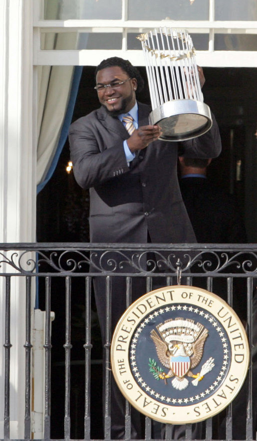 Boston Red Sox's slugger David Ortiz raises the 2007 World Championship Trophy for the crowd during a ceremony honoring the Boston Red Sox Wednesday, Feb. 27, 2008, at the White House. White House photo by Joyce N. Boghosian