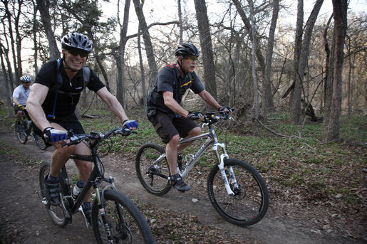 President George W. Bush and Prime Minister Anders Fogh Rasmussen of Denmark enjoy a bike ride at The Bush Ranch in Crawford, Texas, Friday, Feb. 29, 2008. White House photo by Eric Draper