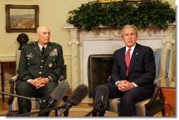 President George W. Bush speaks to reporters during a meeting with former Commanding General of Multi-National Corps-Iraq, Lieutenant General Ray Odierno, Monday March 3, 2008, in the Oval Office. President Bush has nominated General Odierno to Vice Chief of Staff of the Army and thanked him for his 30 months of service in Iraq.  White House photo by Joyce N. Boghosian