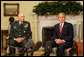 President George W. Bush speaks to reporters during a meeting with former Commanding General of Multi-National Corps-Iraq, Lieutenant General Ray Odierno, Monday March 3, 2008, in the Oval Office. President Bush has nominated General Odierno to Vice Chief of Staff of the Army and thanked him for his 30 months of service in Iraq. White House photo by Joyce N. Boghosian