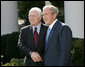 President George W. Bush and Senator John McCain (R-Ariz.) shake hands as they deliver a statement Wednesday, March 5, 2008, in the Rose Garden of the White House. Said the President in his endorsement of Senator McCain, "John showed incredible courage and strength of character and perseverance in order to get to this moment. And that's exactly what we need in a President." White House photo by Chris Greenberg