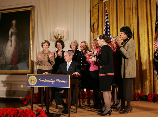 President George W. Bush is applauded by Mrs. Laura Bush, Cabinet members and members of Congress, at the proclamation signing for Women's History Month Monday, March 10, 2008 in the East Room of the White House in honor of Women's History Month and International Women's Day. From left are, U.S. Secretary of Labor Elaine Chao, U.S. Secretary of Transportation Mary Peters; New York Rep. Carolyn Mahoney, Rep. Marsha Blackburn of Tennessee, Rep. Judy Biggert of Illinois, Rep. Mary Fallin of Oklahoma, Rep. Shelley Moore Capito of West Virginia, Rep. Dianne Watson of California and Rep. Jean Schmidt of Ohio. White House photo by Joyce N. Boghosian